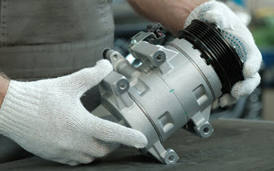 Porsche Mechanic Holding New AC Compressor